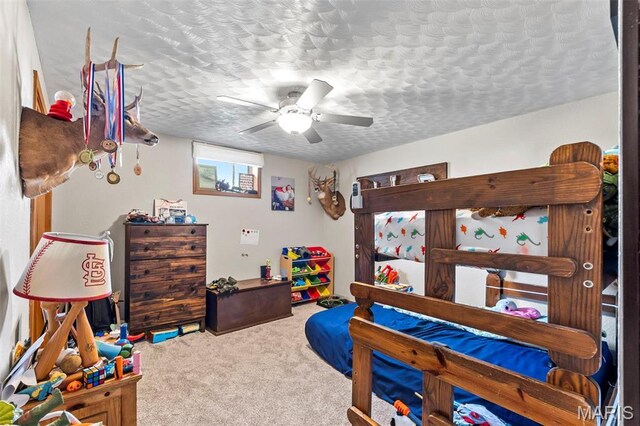 218 County Highway 275, Oran, MO 63771 - carpeted bedroom featuring a ceiling fan and a textured ceiling