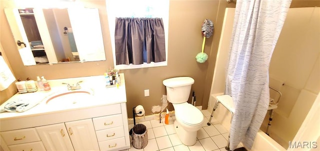 full bath with tile patterned floors, toilet, vanity, and shower / bath combo with shower curtain