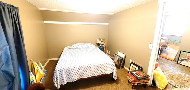 carpeted bedroom with lofted ceiling and baseboards
