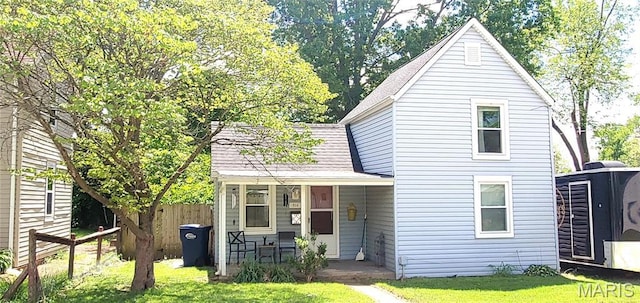 view of front of property with covered porch and roof with shingles
