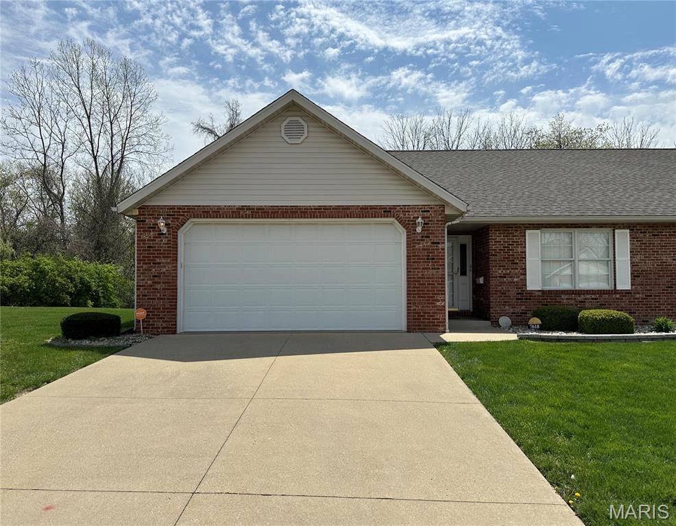7618 Baxter Dr, Belleville, IL 62223 - ranch-style house featuring brick siding, concrete driveway, a front lawn, a garage, and a shingled roof