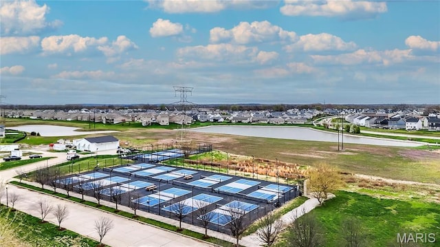 aerial perspective of suburban area with a large body of water