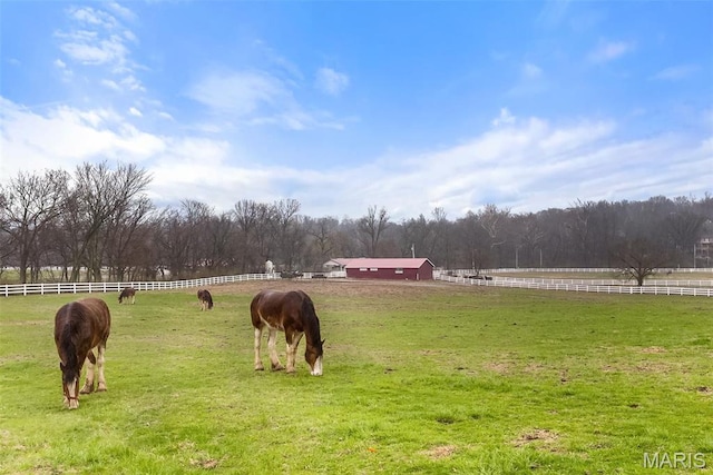 view of community with a view of rural / pastoral area and an outdoor riding arena