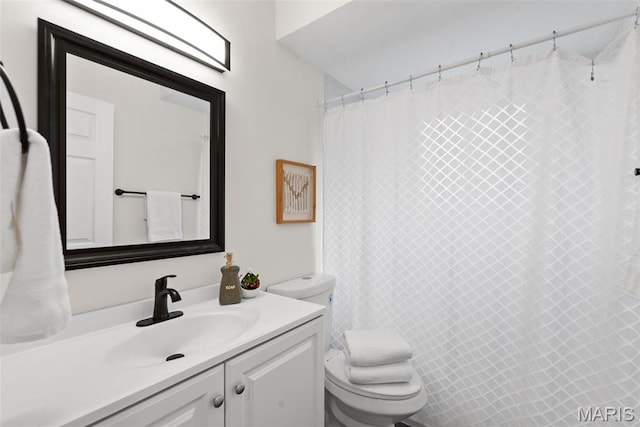 full bathroom with toilet, vanity, and a shower with shower curtain