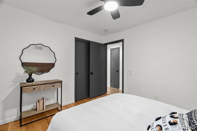 1015 Louisville Ave, Saint Louis, MO 63139 - bedroom featuring light wood finished floors, baseboards, and a ceiling fan