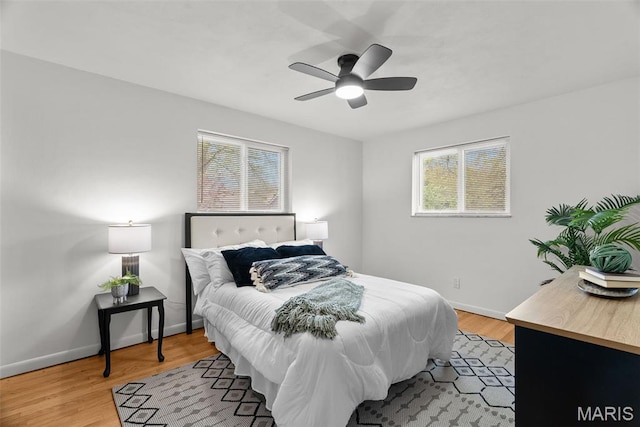 1015 Louisville Ave, Saint Louis, MO 63139 - bedroom with baseboards, light wood-type flooring, and a ceiling fan