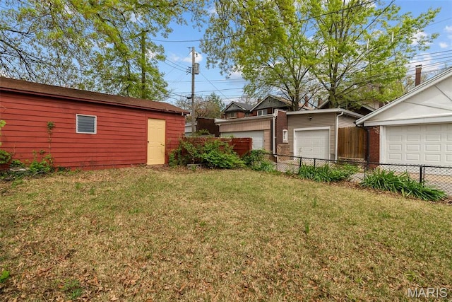 1015 Louisville Ave, Saint Louis, MO 63139 - view of yard with a garage and an outbuilding
