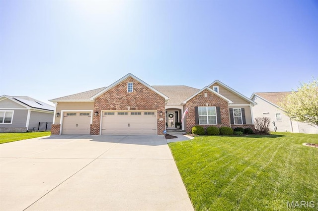 view of front of house featuring brick siding, a garage, a front yard, and concrete driveway
