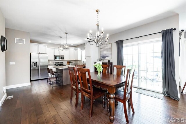 dining room with a chandelier, baseboards, dark wood finished floors, and recessed lighting