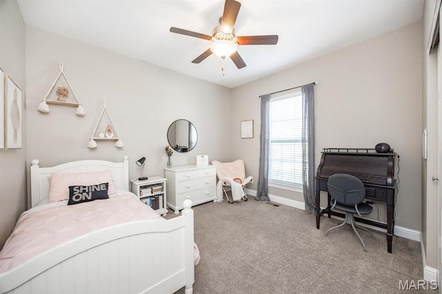 carpeted bedroom featuring baseboards and ceiling fan