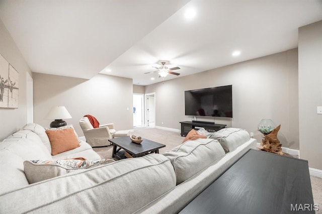living room with light carpet, recessed lighting, baseboards, and ceiling fan