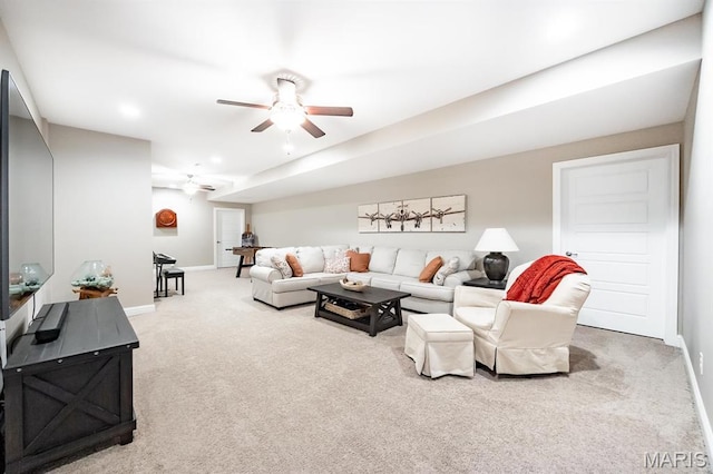 carpeted living area with ceiling fan, baseboards, and recessed lighting