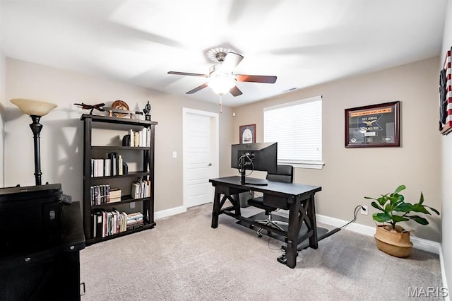 office space featuring ceiling fan, carpet floors, and baseboards