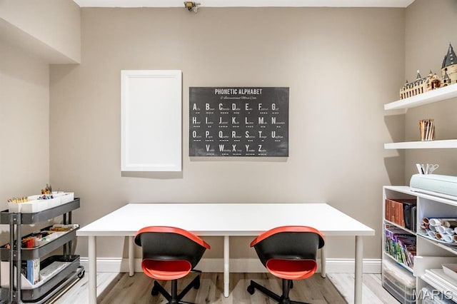 office with wood finished floors and baseboards