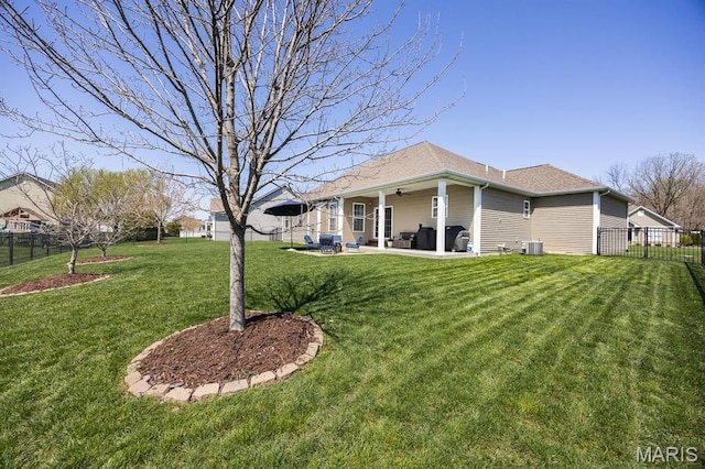 view of yard featuring ceiling fan and a patio
