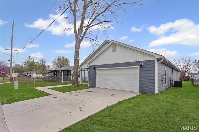 731 Dugger St, Bethalto, IL 62010 - view of property exterior with a yard, driveway, a garage, and central AC unit