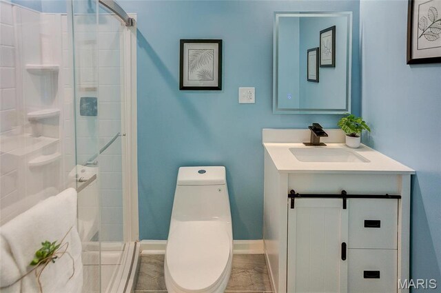 731 Dugger St, Bethalto, IL 62010 - bathroom with toilet, a shower stall, vanity, and baseboards