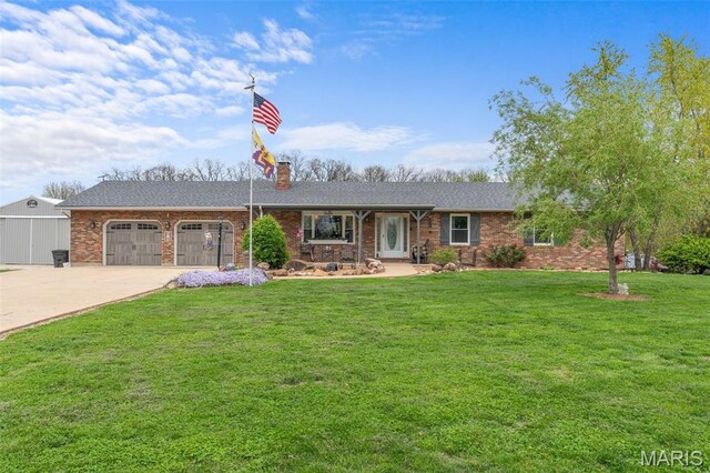 ranch-style home with driveway, an attached garage, a front lawn, a chimney, and brick siding