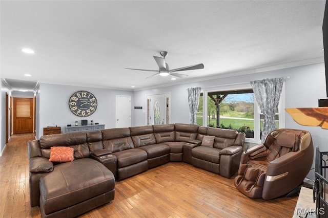 living area with ceiling fan, ornamental molding, light wood-style floors, and recessed lighting