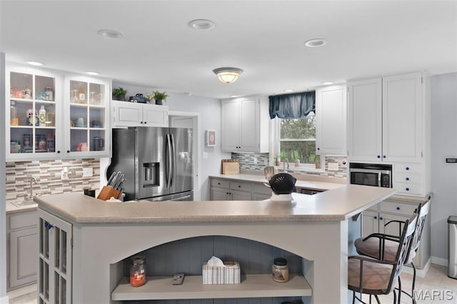 kitchen featuring stainless steel appliances, open shelves, decorative backsplash, and recessed lighting