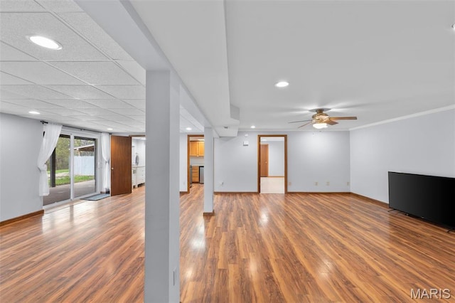 unfurnished living room featuring wood finished floors, baseboards, a ceiling fan, and recessed lighting