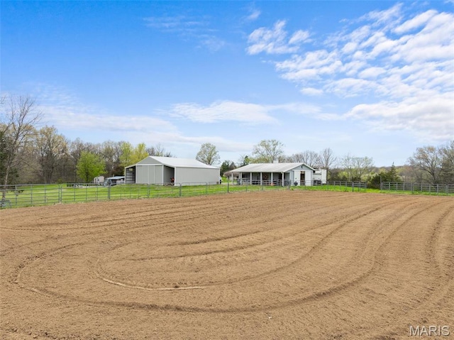 view of property's community with an outdoor riding arena and a view of countryside