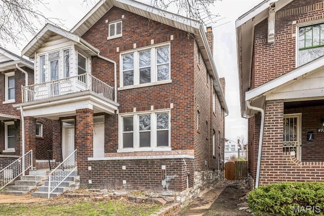 4931 Mardel Ave, Saint Louis, MO 63109 - view of front of house with a balcony and brick siding
