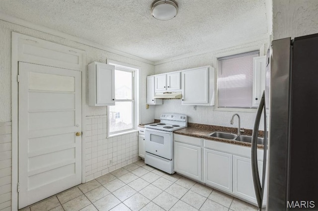 4931 Mardel Ave, Saint Louis, MO 63109 - kitchen with white range with electric cooktop, freestanding refrigerator, a textured ceiling, dark countertops, and white cabinetry