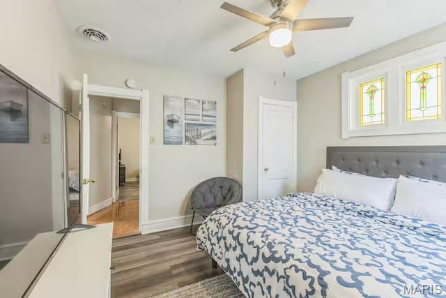 4931 Mardel Ave, Saint Louis, MO 63109 - bedroom featuring dark wood-type flooring, baseboards, and ceiling fan
