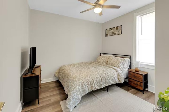 4931 Mardel Ave, Saint Louis, MO 63109 - bedroom with wood finished floors, baseboards, and a ceiling fan