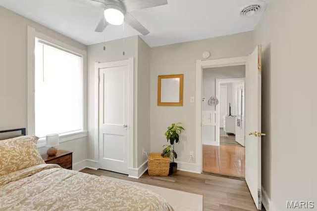 4931 Mardel Ave, Saint Louis, MO 63109 - bedroom with wood finished floors, baseboards, and ceiling fan
