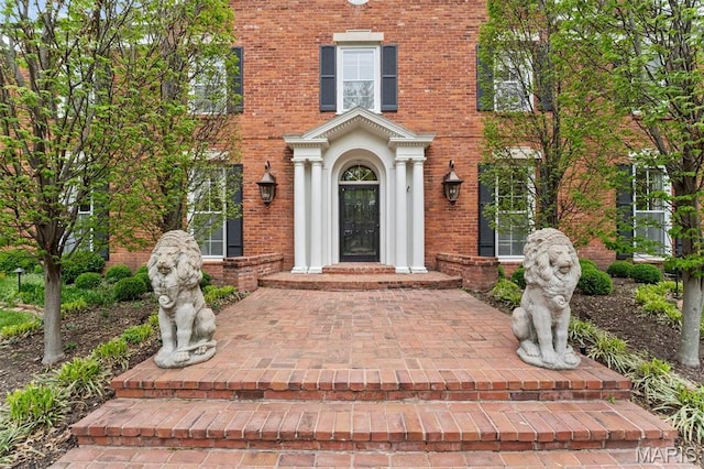 21 Log Cabin Dr, Saint Louis, MO 63124 - view of exterior entry featuring brick siding