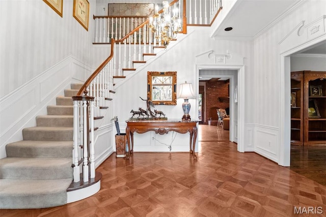21 Log Cabin Dr, Saint Louis, MO 63124 - stairway with a decorative wall, ornamental molding, and wainscoting