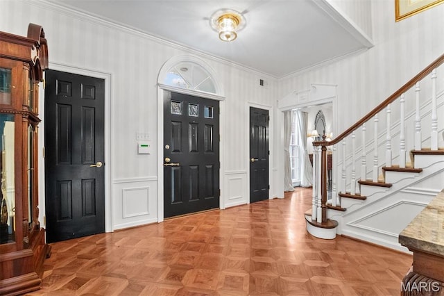 21 Log Cabin Dr, Saint Louis, MO 63124 - entrance foyer with crown molding, stairs, and a decorative wall