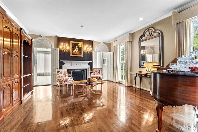 21 Log Cabin Dr, Saint Louis, MO 63124 - living area featuring plenty of natural light, crown molding, wood finished floors, a high end fireplace, and baseboards