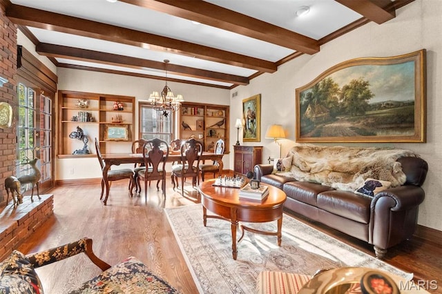 21 Log Cabin Dr, Saint Louis, MO 63124 - living room featuring beam ceiling, a chandelier, wood finished floors, and baseboards
