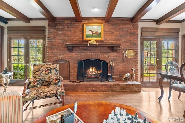 21 Log Cabin Dr, Saint Louis, MO 63124 - living room featuring beam ceiling, wood finished floors, healthy amount of natural light, a fireplace, and french doors