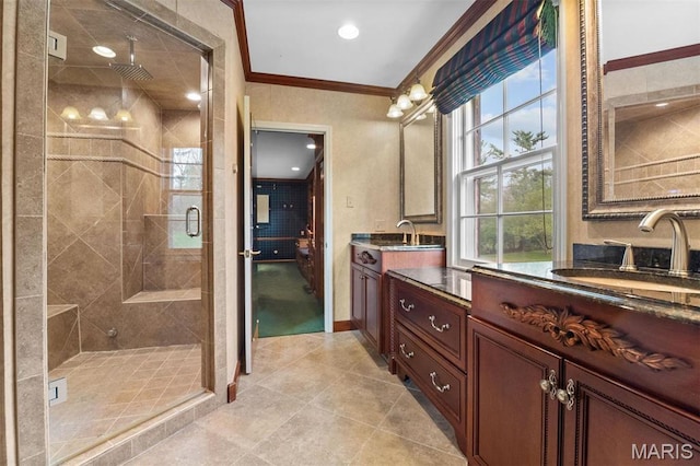 21 Log Cabin Dr, Saint Louis, MO 63124 - full bathroom featuring crown molding, a stall shower, tile patterned floors, two vanities, and baseboards