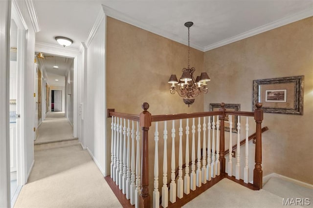 21 Log Cabin Dr, Saint Louis, MO 63124 - hallway featuring carpet floors, an upstairs landing, baseboards, crown molding, and a chandelier