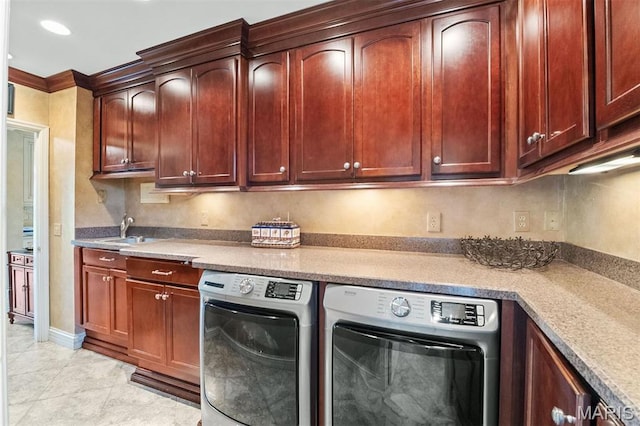 21 Log Cabin Dr, Saint Louis, MO 63124 - laundry area featuring washing machine and clothes dryer, cabinet space, light tile patterned floors, and recessed lighting