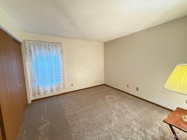 31 Berview Cir Unit H, Saint Louis, MO 63129 - unfurnished room with carpet floors and baseboards