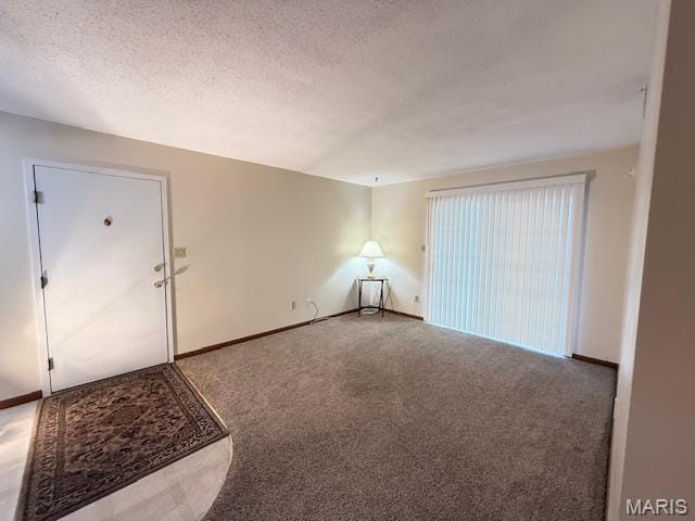 31 Berview Cir Unit H, Saint Louis, MO 63129 - carpeted spare room featuring a textured ceiling and baseboards