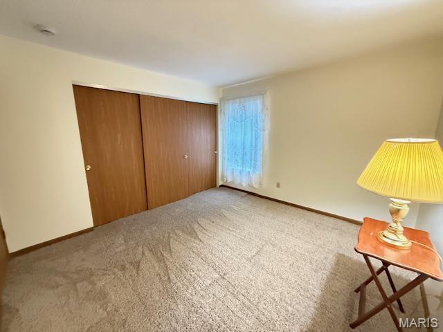 31 Berview Cir Unit H, Saint Louis, MO 63129 - unfurnished bedroom featuring carpet flooring and a closet