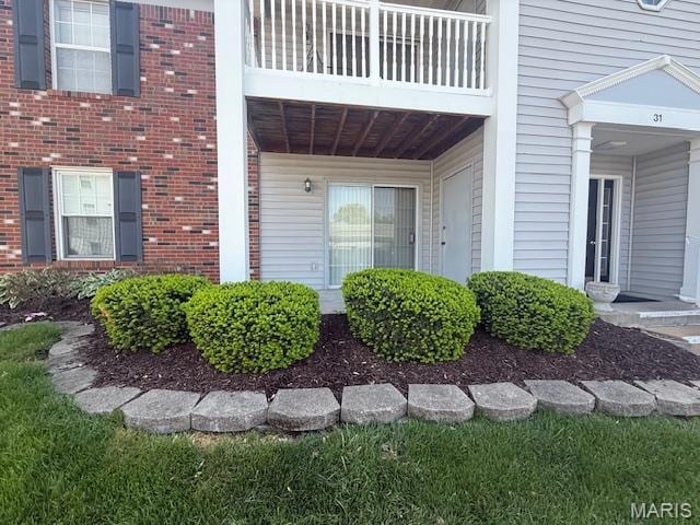 31 Berview Cir Unit H, Saint Louis, MO 63129 - doorway to property featuring a balcony and brick siding