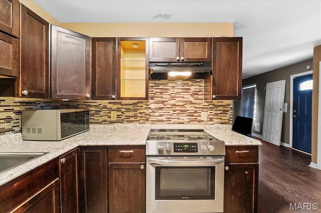 4321 E Fairfax Ct, Saint Louis, MO 63113 - kitchen featuring stainless steel range with gas cooktop, under cabinet range hood, decorative backsplash, and dark brown cabinets