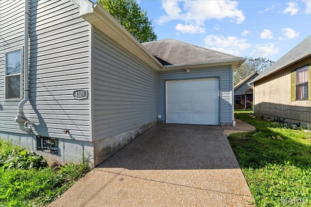 4321 E Fairfax Ct, Saint Louis, MO 63113 - view of property exterior featuring driveway and a garage