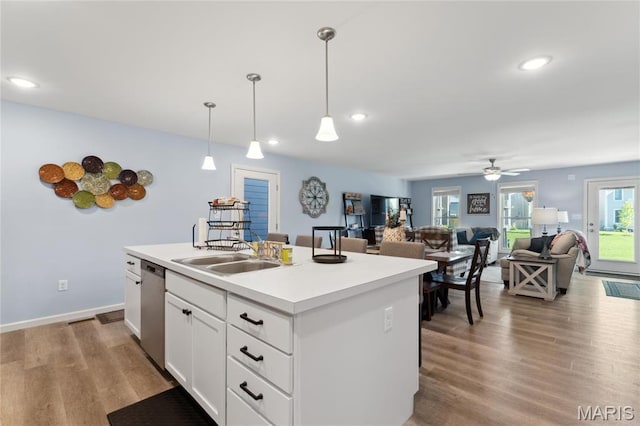 104 Tiber Way, Saint Charles, MO 63301 - kitchen featuring a sink, stainless steel dishwasher, ceiling fan, decorative light fixtures, and light countertops