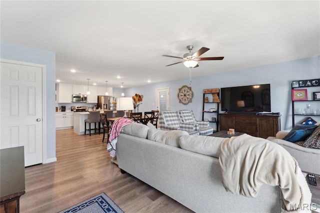 104 Tiber Way, Saint Charles, MO 63301 - living area with light wood finished floors, ceiling fan, and recessed lighting