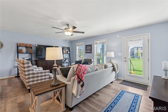 104 Tiber Way, Saint Charles, MO 63301 - living area featuring a ceiling fan, wood finished floors, and baseboards