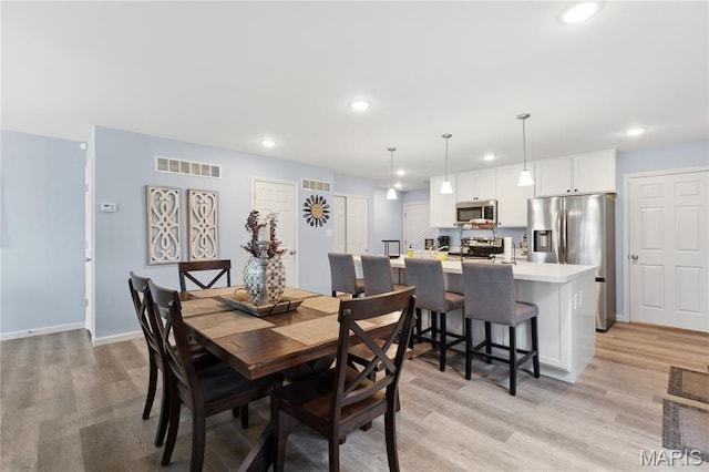 104 Tiber Way, Saint Charles, MO 63301 - dining space with light wood finished floors, recessed lighting, and baseboards